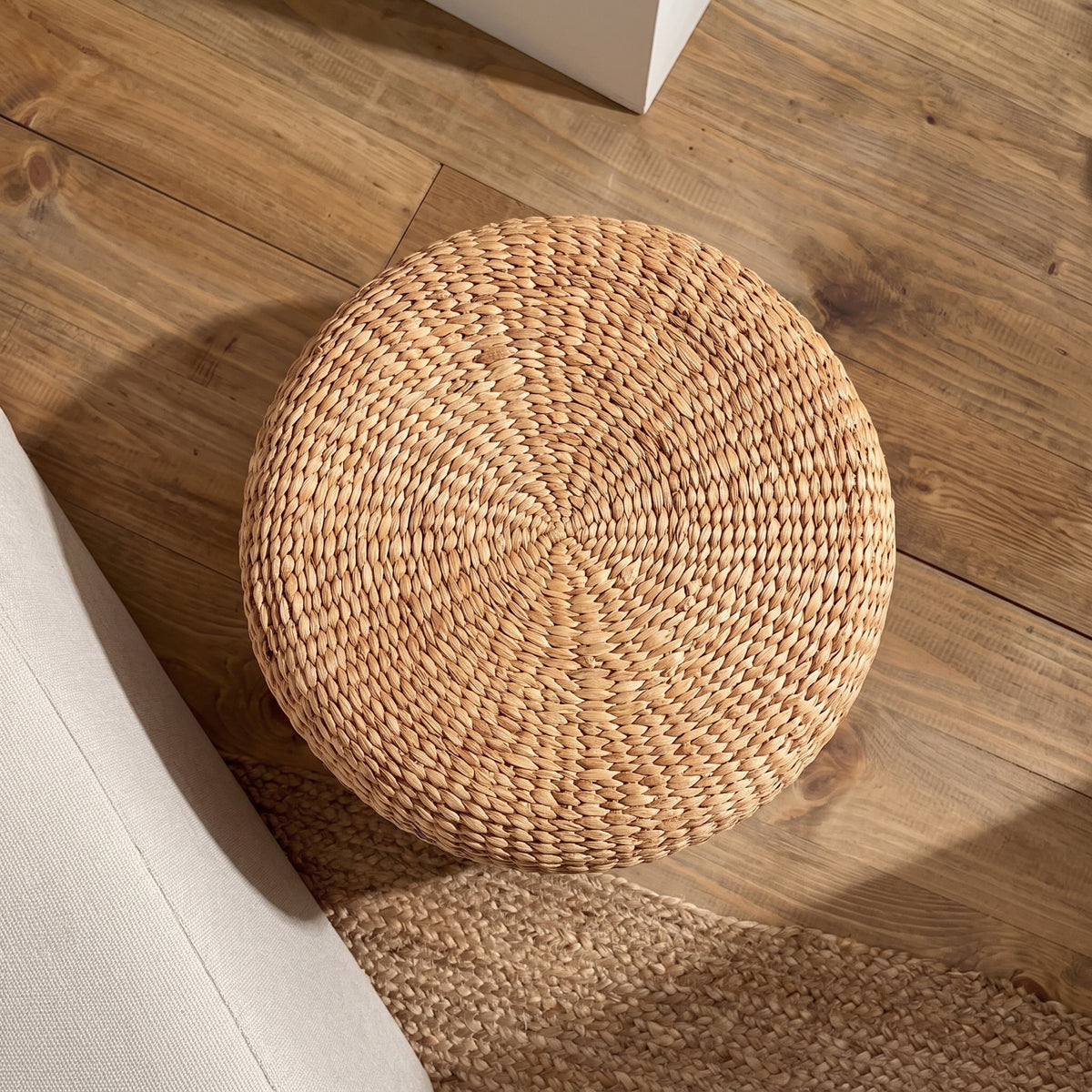 Puf baúl redondo de jacinto de agua trenzado natural 60 cm