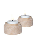 Set 2 photophores travertin naturel avec chauffe-plats allumés vue trois quarts fond blanc