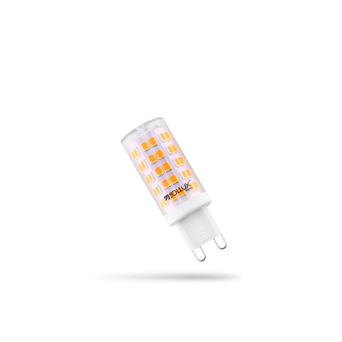 Ampoule LED G9 capsule translucide à diodes apparentes et deux broches sur fond blanc