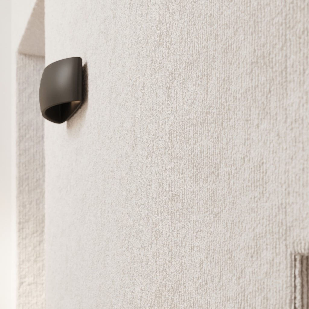 Applique Pontius en céramique noire en situation dans une décoration soignée