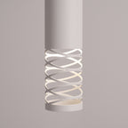 Détail de la découpe en spirale du tube Lami éclairée de l'intérieur
