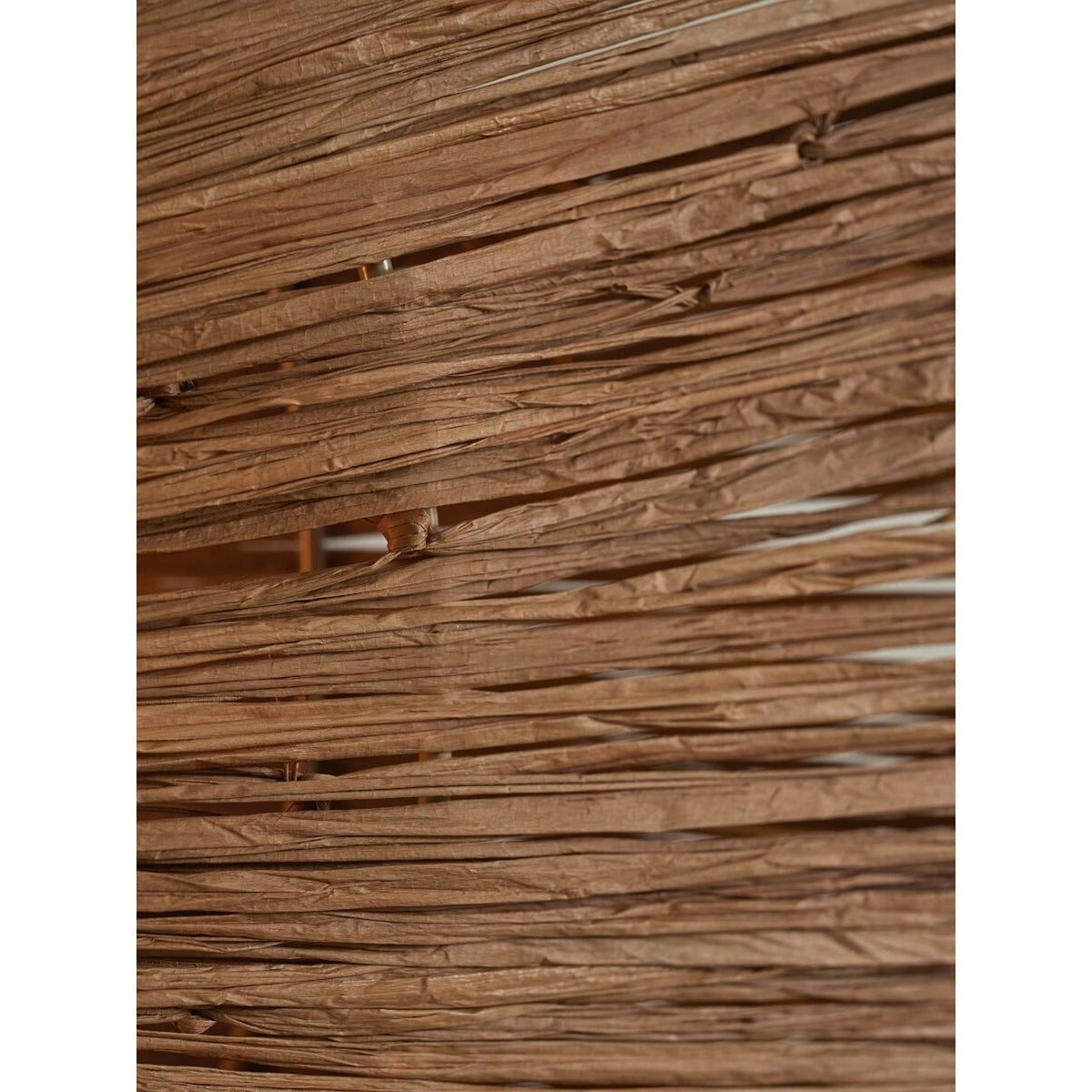 Texture des lanières de raphia brun de l'applique Panama en gros plan