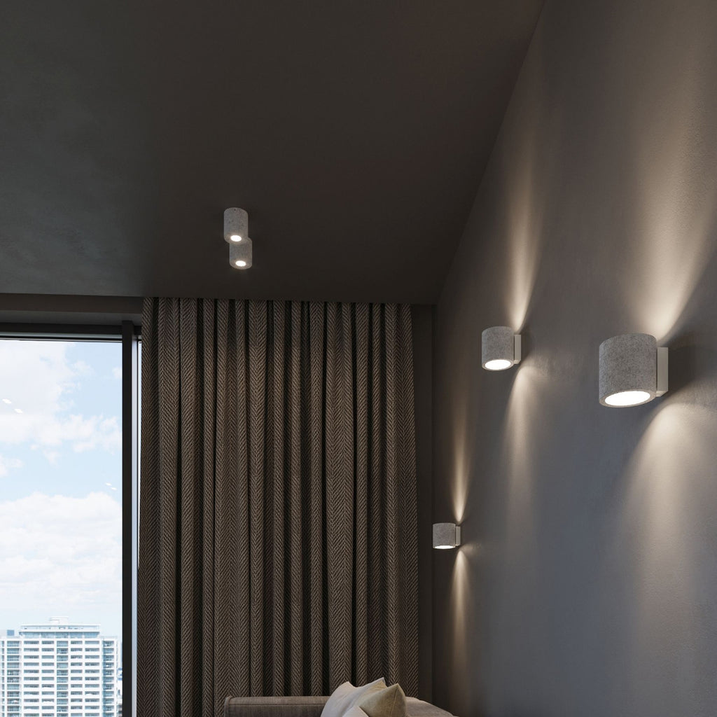 Luminaires Orbis béton en situation dans une chambre contemporaine