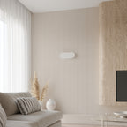 Applique Saccon acier blanc au-dessus d'un lit
