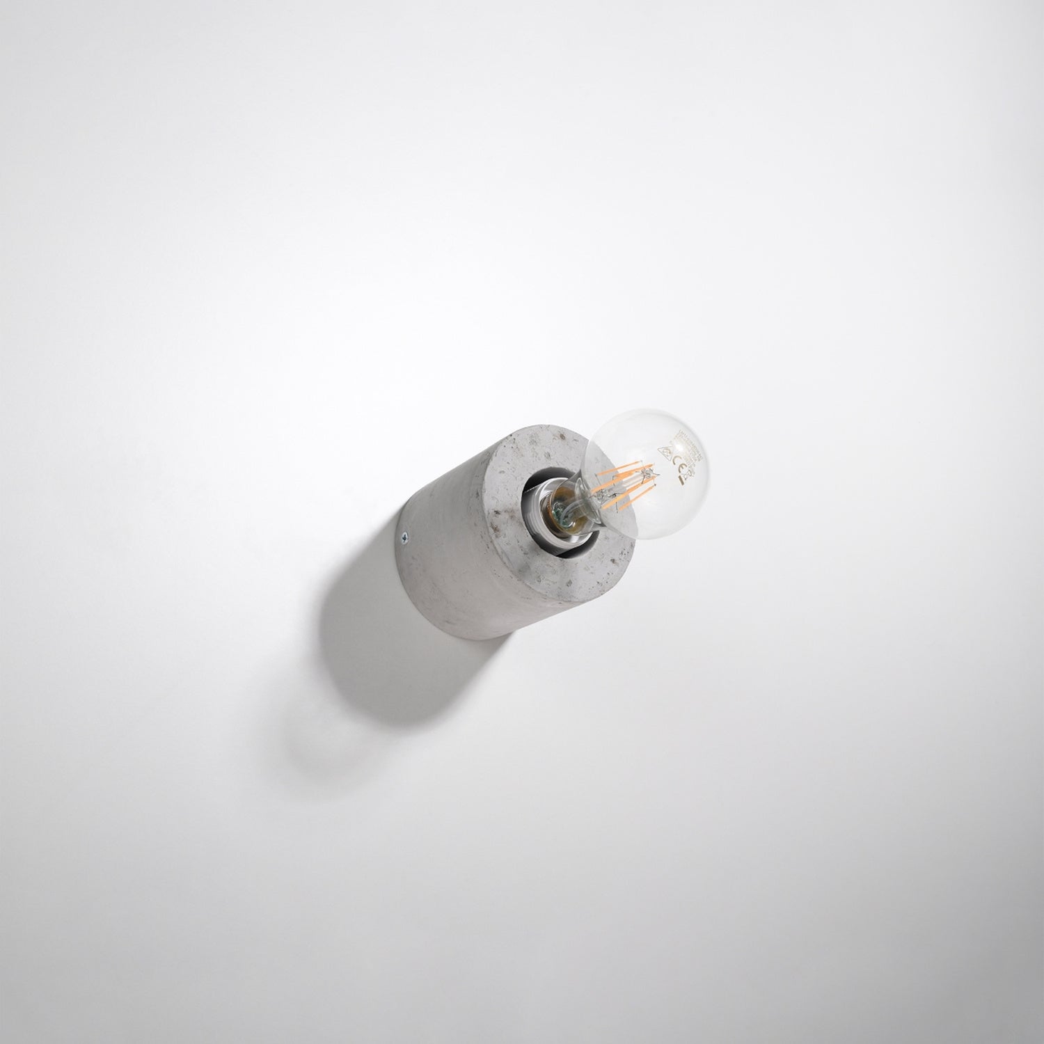 Applique Salgado en béton brut, cylindre à ampoule apparente, vue de profil