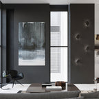 Applique Solido acier noir éclairant un mur