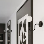 Applique Vector métal noire E27 en situation dans un intérieur