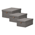 Set 3 boîtes rangement Noto textile gris foncé couvercle languette cuir vue trois quarts