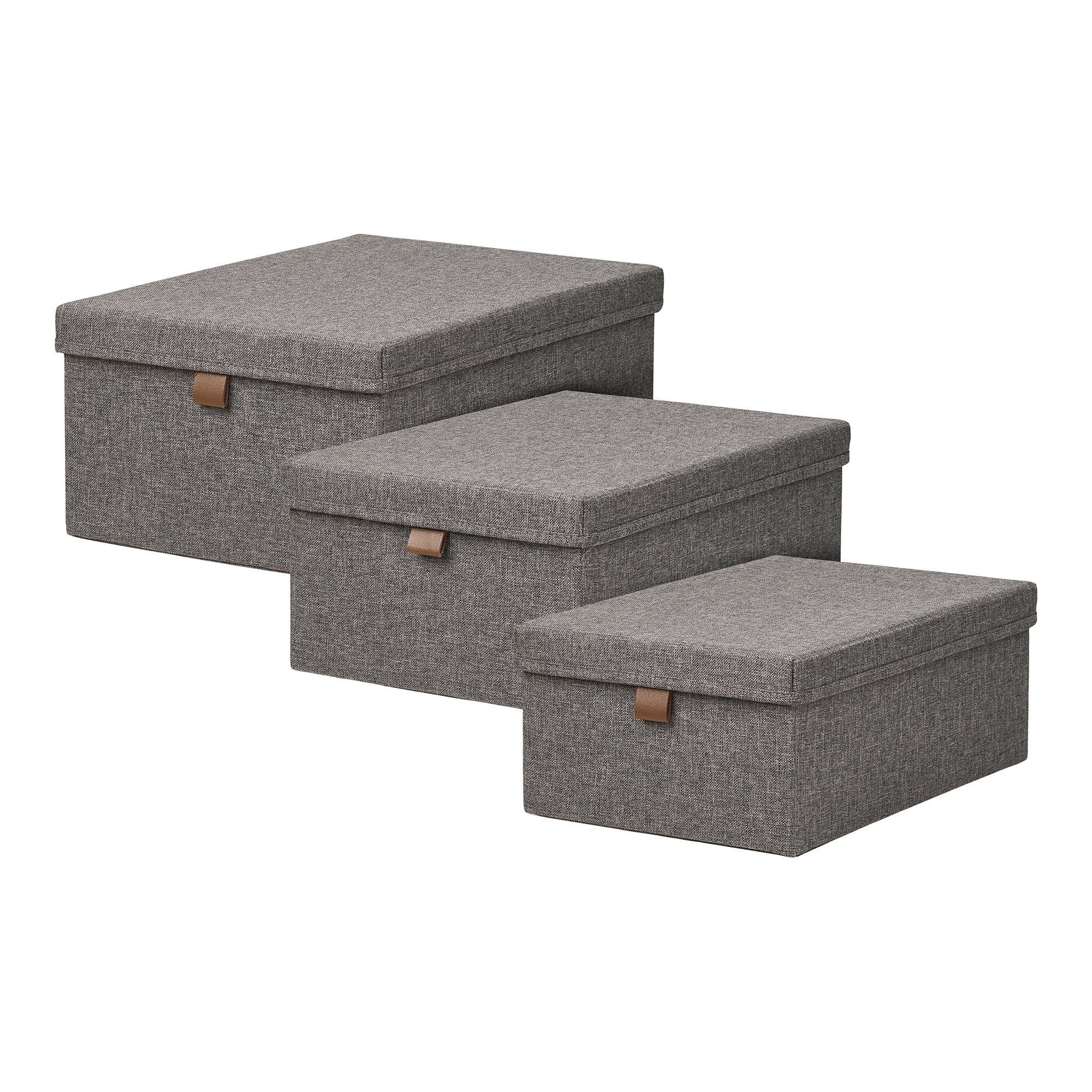 Set 3 boîtes rangement Noto textile gris foncé couvercle languette cuir vue trois quarts