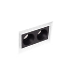 Boîtier encastré Modular blanc sans cadre et module à deux cellules noires vus de biais