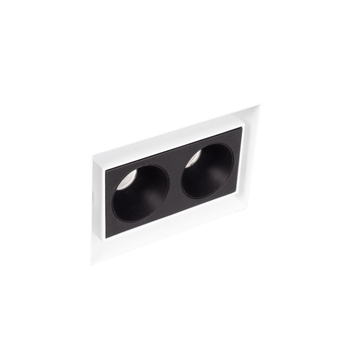 Boîtier encastré Modular blanc sans cadre et module à deux cellules noires vus de biais