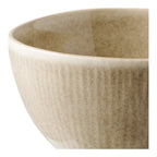 Détail de la texture côtelée et de la glaçure réactive beige du bol Viola