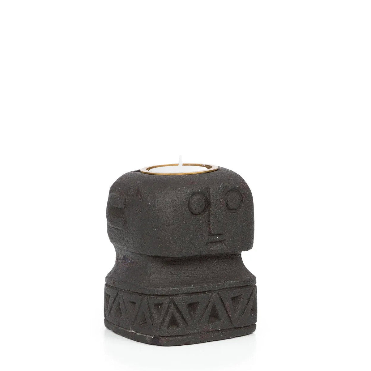 Bougeoir visage en pierre noire vu de trois quarts avec son oreille sculptée et une bougie chauffe-plat