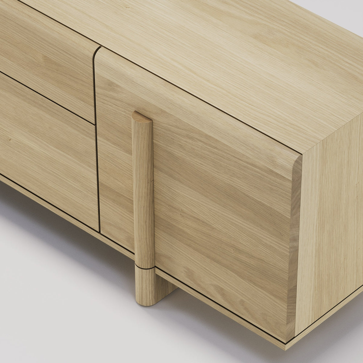 Détail de l'angle du plateau et du montant rond du buffet Brutalist en chêne naturel