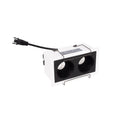 Cadre encastré Modular blanc équipé du module à deux cellules noires et de son câble à fiche vu de trois quarts