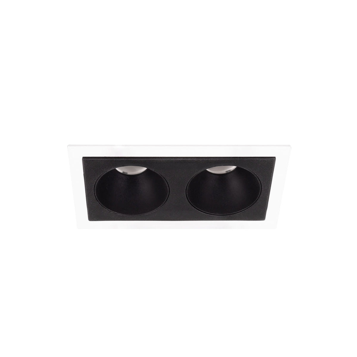 Cadre encastré Modular blanc et module à deux cellules noires vus de biais depuis le dessous
