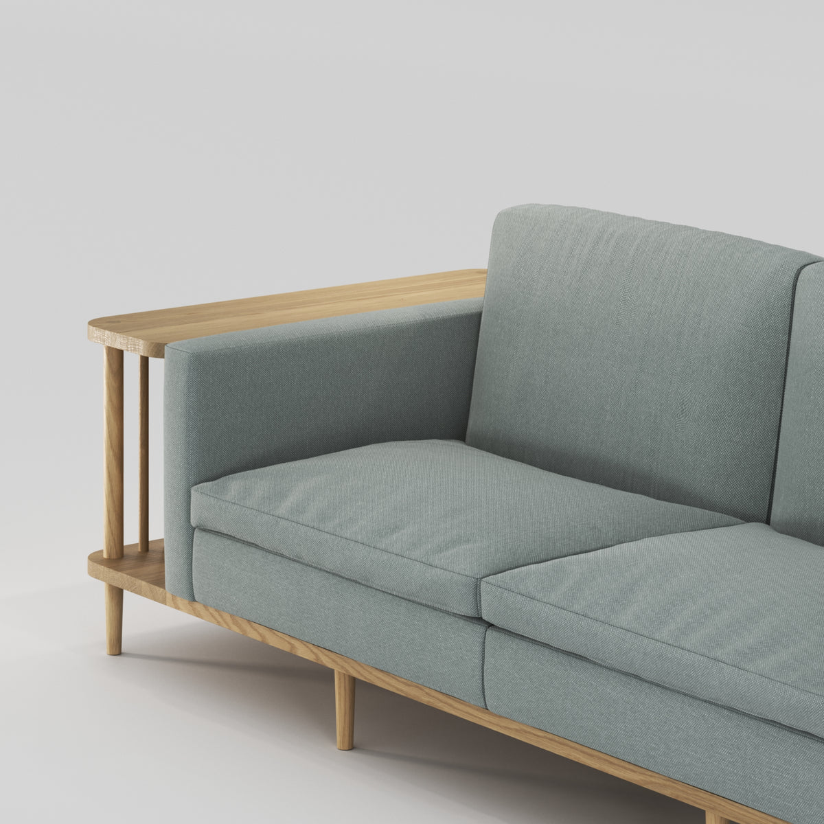 Accoudoir et assise du canapé bibliothèque Scaffold en chêne et tissu gris-vert vus de près