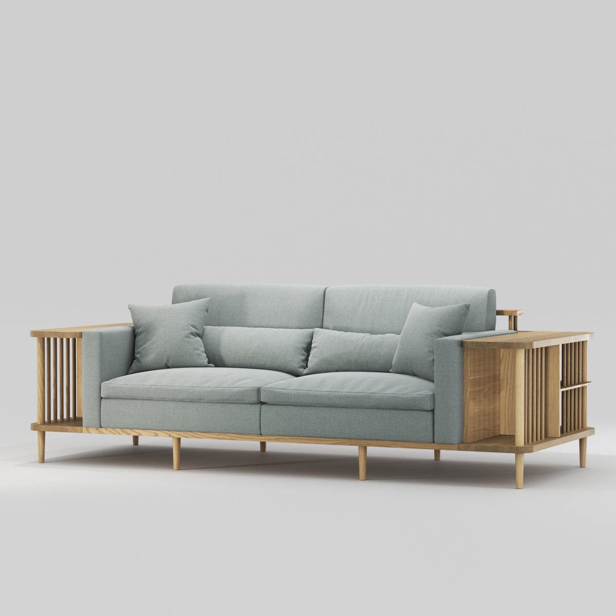 Canapé bibliothèque Scaffold en chêne et tissu gris-vert vu de trois quarts, avec des coussins décoratifs