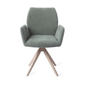 Chaise de salle à manger Misaki vert sauge sur piètement pivotant beige vue de face dossier galbé et accoudoirs évasés