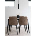 Chaises Middelfart microfibre brun clair vues de dos autour table blanche pieds noirs avec suspension noire