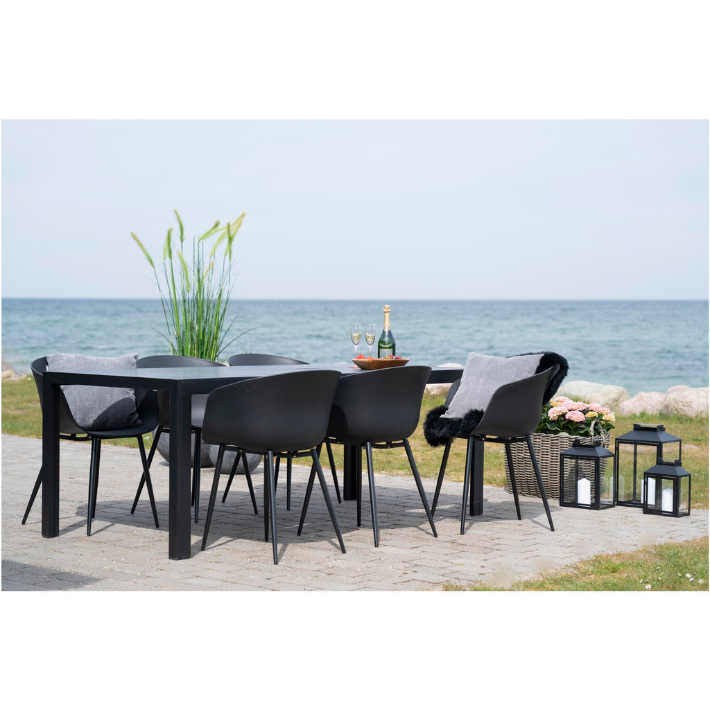 Ensemble repas jardin chaises Roda noires avec coussins gris terrasse côtière
