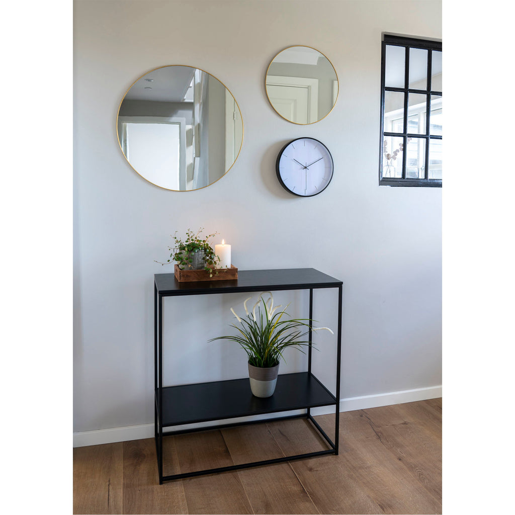 Console Vita noir étagère entrée miroirs ronds dorés pendule murale plante verte