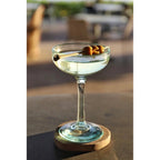 Dessous-de-verre Boho en rondelle de teck brut 10 cm en situation