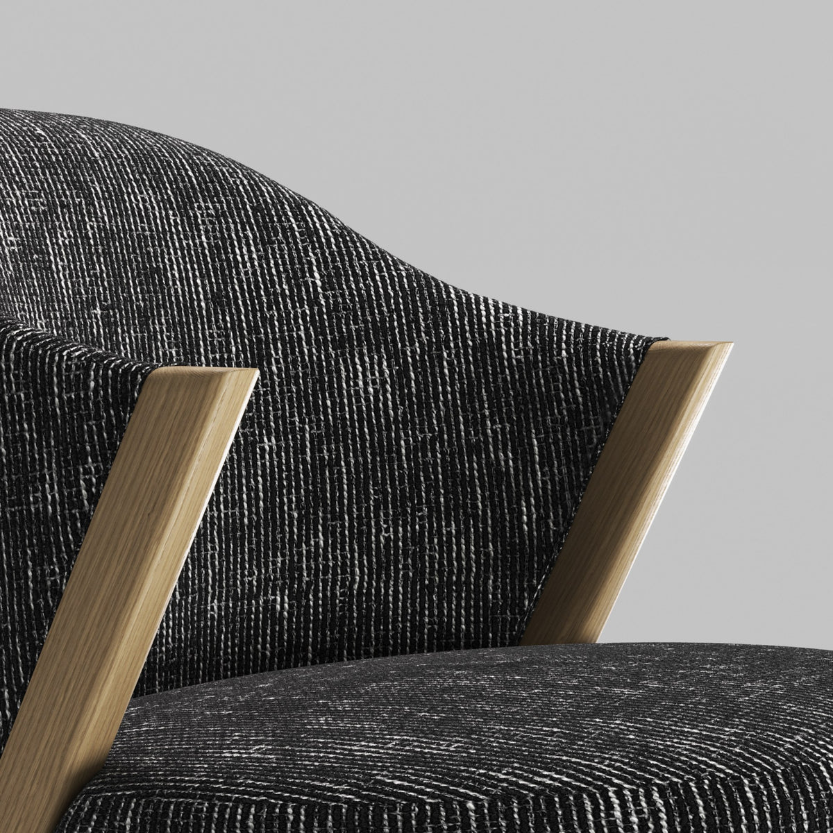 Détail du garnissage du fauteuil lounge Caravela en chêne et tissu chiné noir