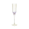 Flûte à champagne en verre côtelé vue de face avec sa base de coupe lilas et son pied aux reflets dorés