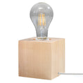 Lampe à poser Ariz en bois naturel, cube massif à ampoule apparente, vue de face