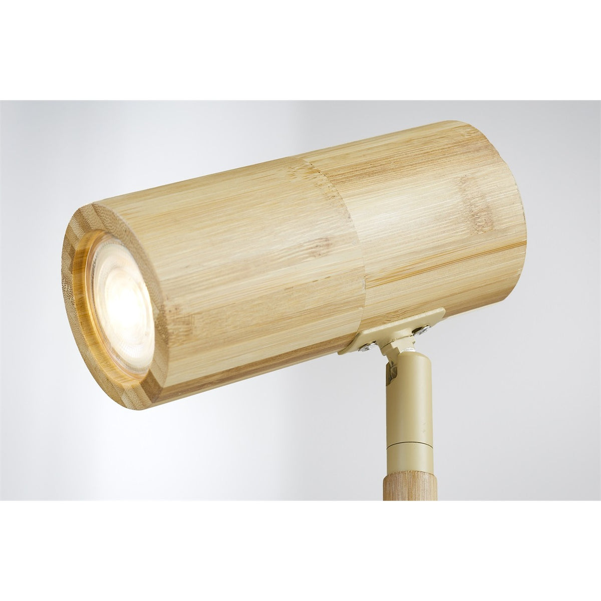 Tête spot allumée de la lampe Java bambou naturel et son articulation métallique