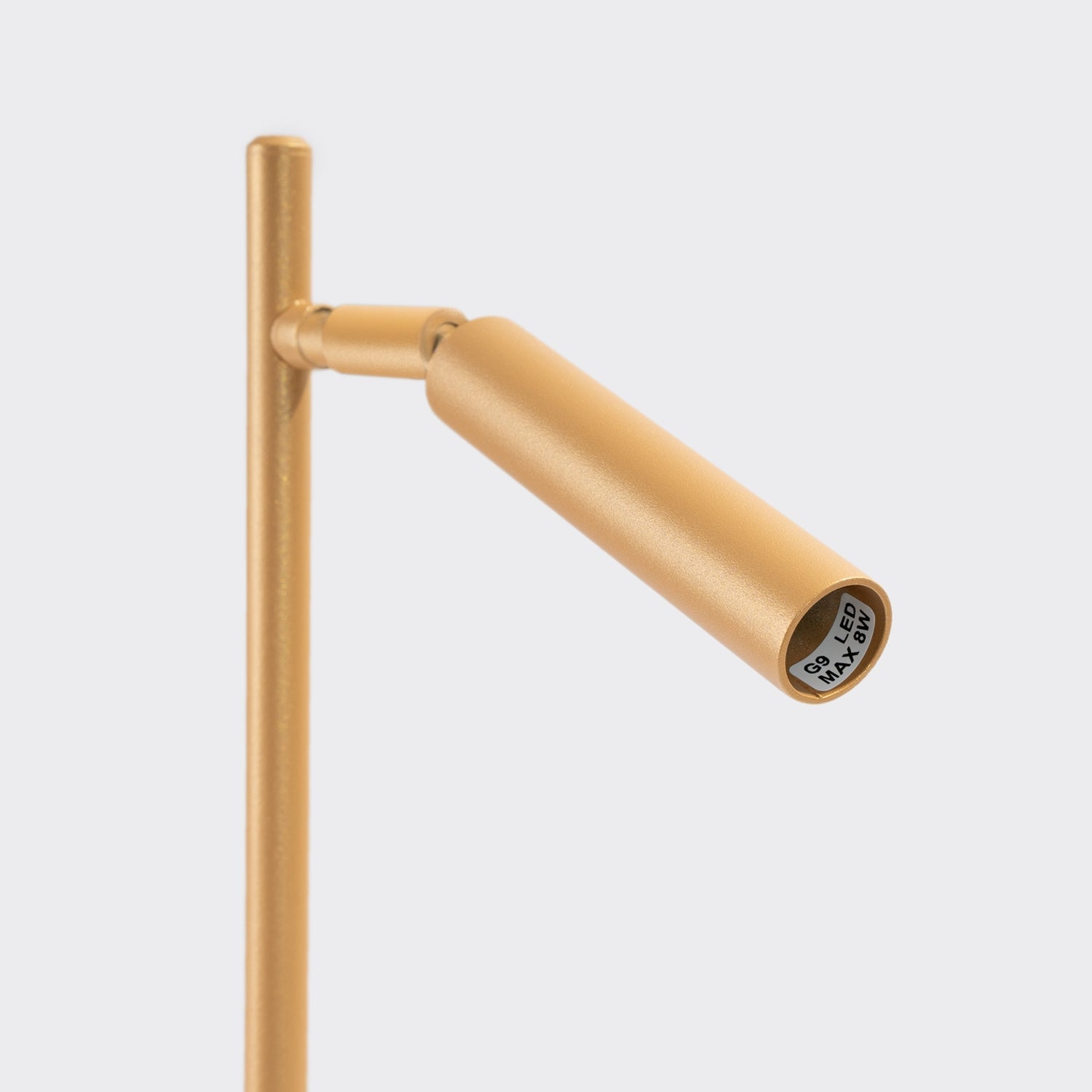 Lampe à poser Pastelo dorée G9 dans un intérieur