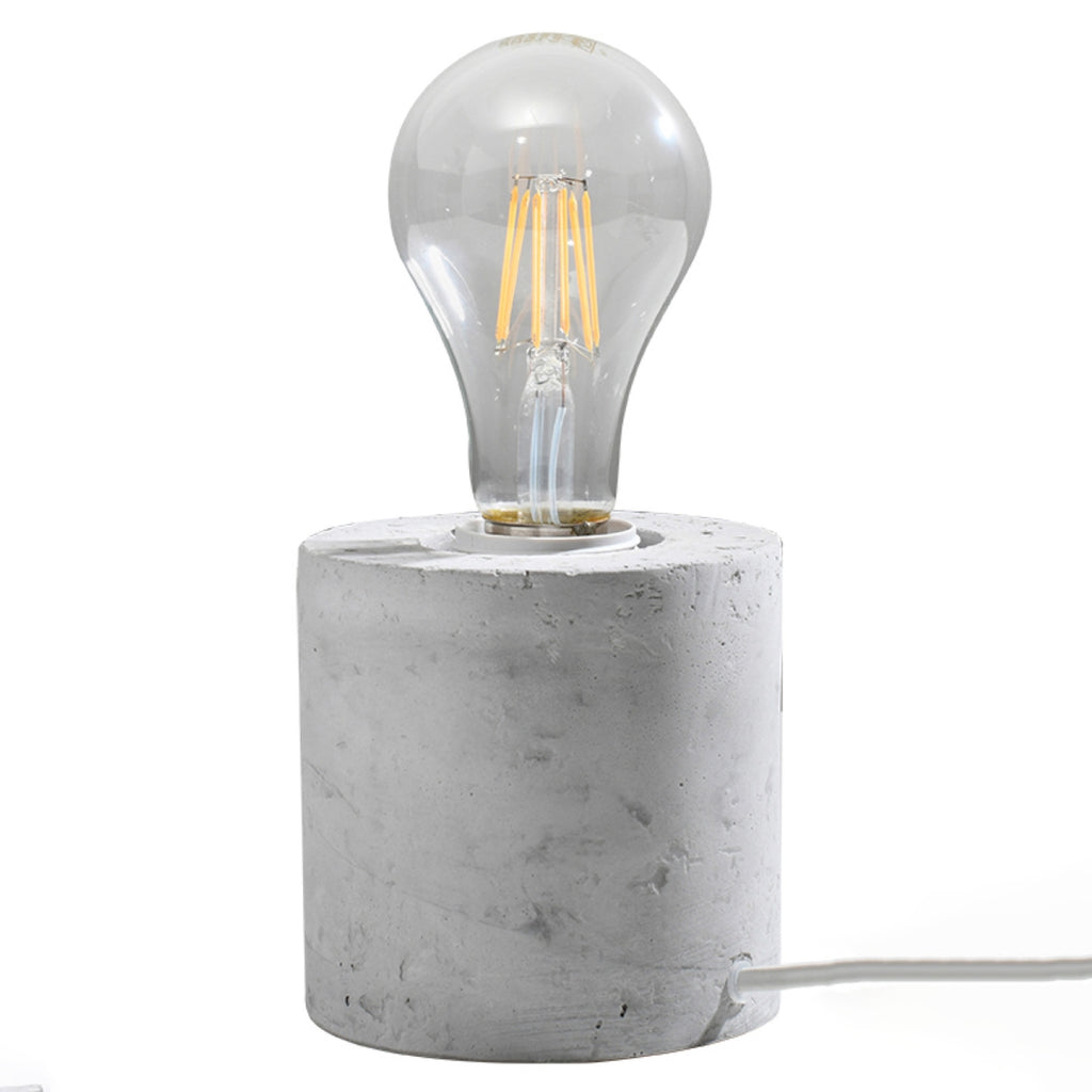 Lampe à poser Salgado en béton brut, cylindre à ampoule apparente, vue de face
