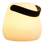 Lampe lanterne Derry allumée en lumière blanche chaude avec anse cuir ambiance cosy