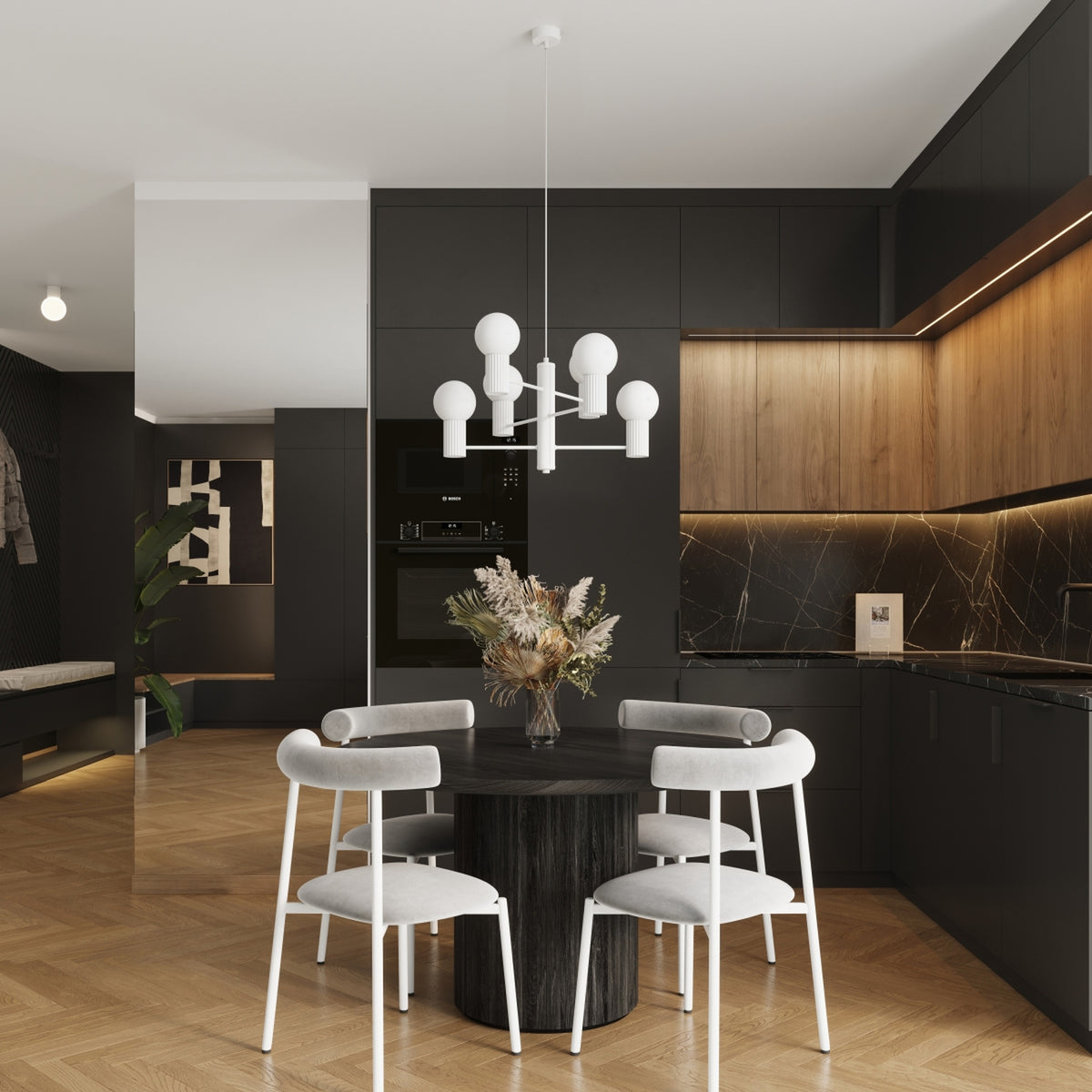 Lustre Halo laque blanche au-dessus d'une table ronde en bois sombre entourée de quatre chaises dans une cuisine ouverte