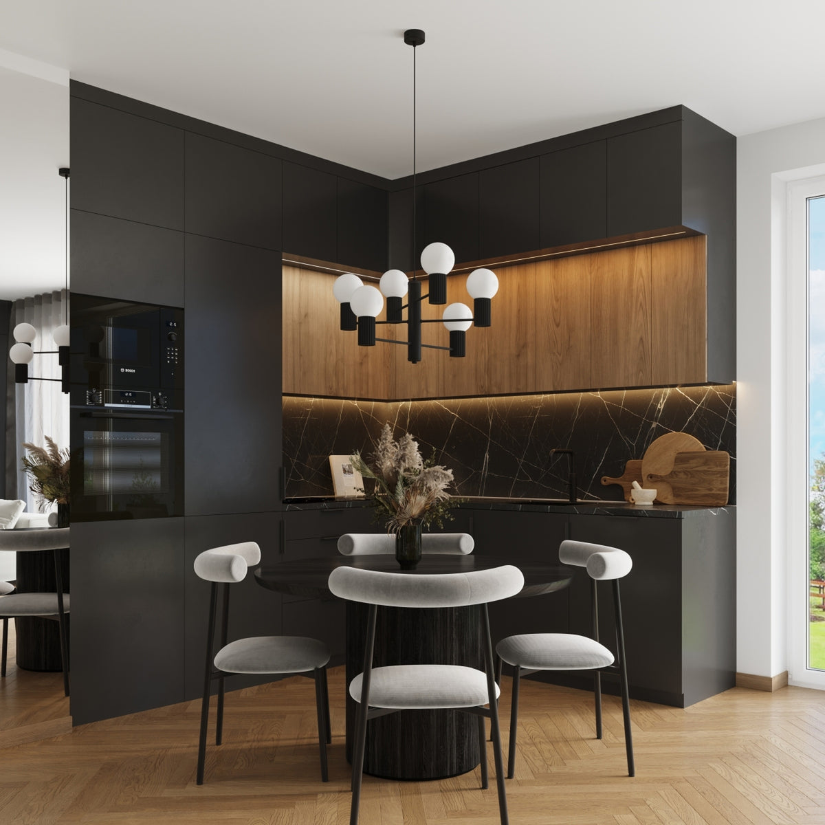 Lustre Halo laque noire au-dessus d'un coin repas dans une cuisine d'angle aux façades sombres et bois