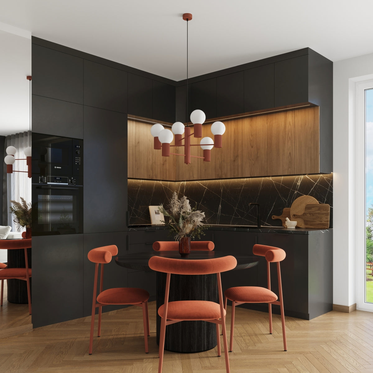 Lustre Halo laque rouge ocre au-dessus d'un coin repas dans une cuisine d'angle aux façades sombres et bois