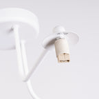 Lustre Astral 3 boules opale acier blanc G9 dans un intérieur
