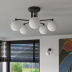 Lustre Astral 5 boules opale acier noir G9 en situation dans un intérieur