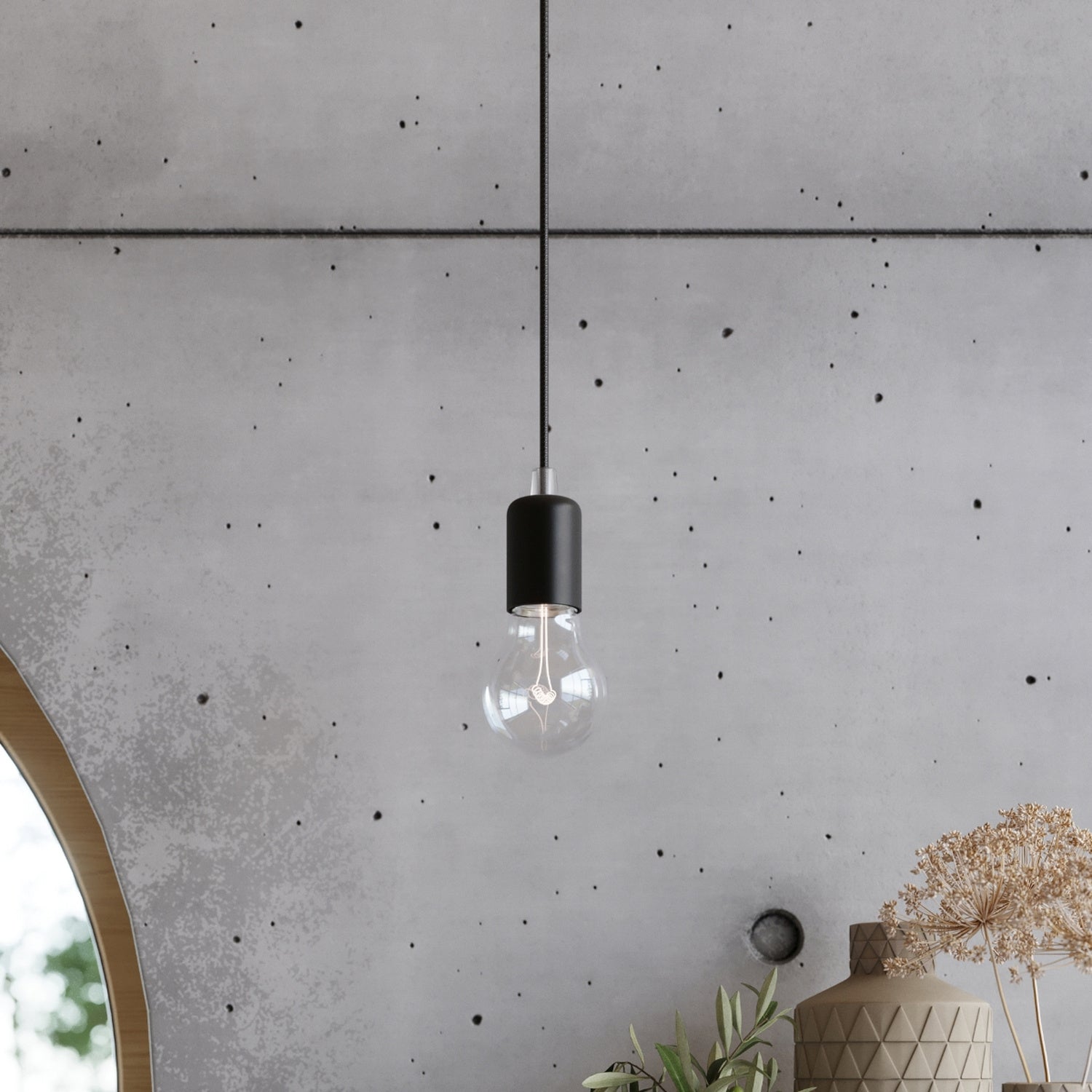 Lustre Edison noir au-dessus d'un espace de vie