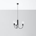 Lustre Piccolo suspendu à son câble devant un mur gris
