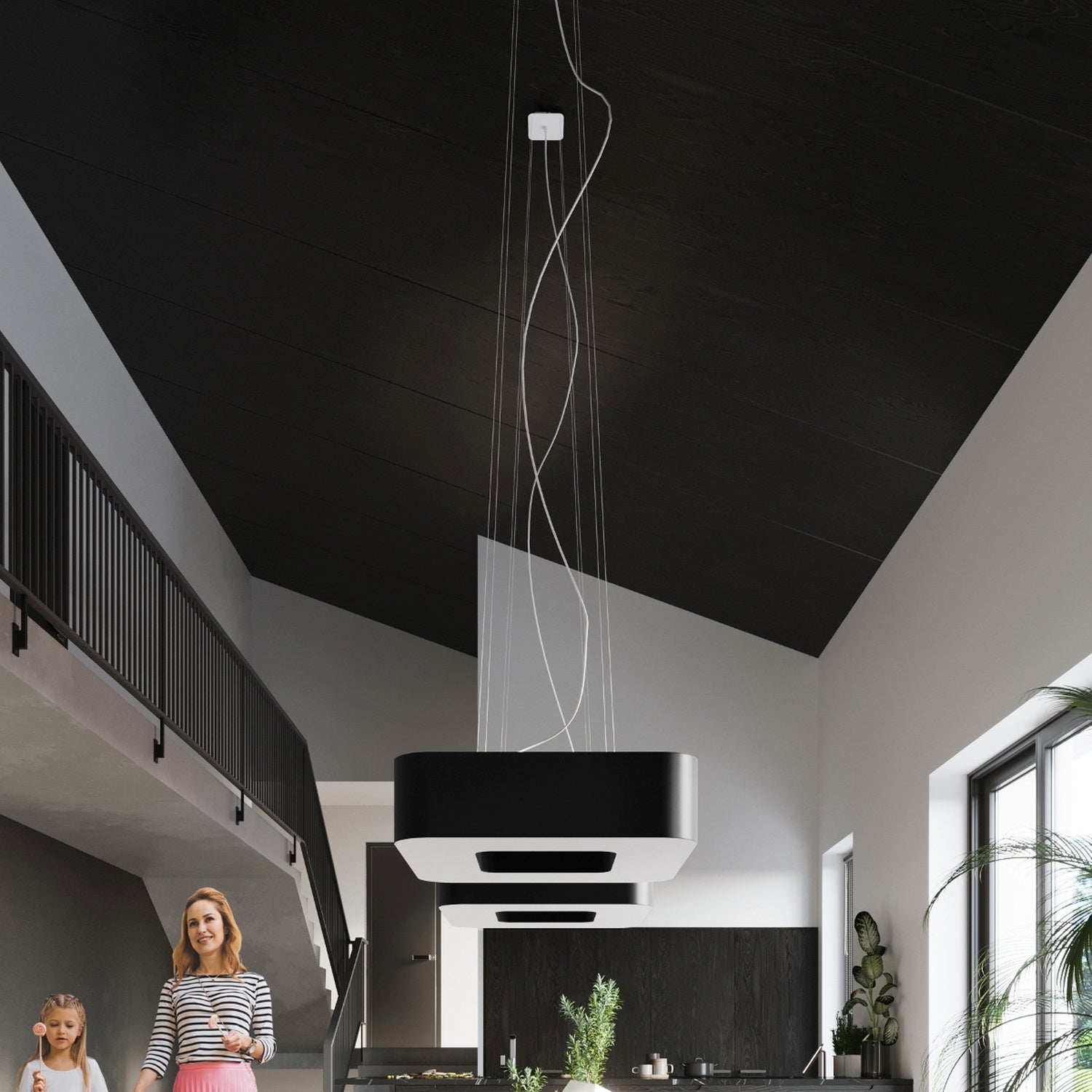 Lustre Urano 80 en tissu noir au-dessus d'une grande table à manger