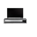Meuble TV Monobloc en béton gris avec un téléviseur posé dessus et sa niche ouverte