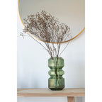 Miroir Madrid rond laiton doré au-dessus d'une console bois ambiance naturelle