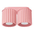 Plafonnier Aura à deux spots cannelés en laque rose sur fond blanc