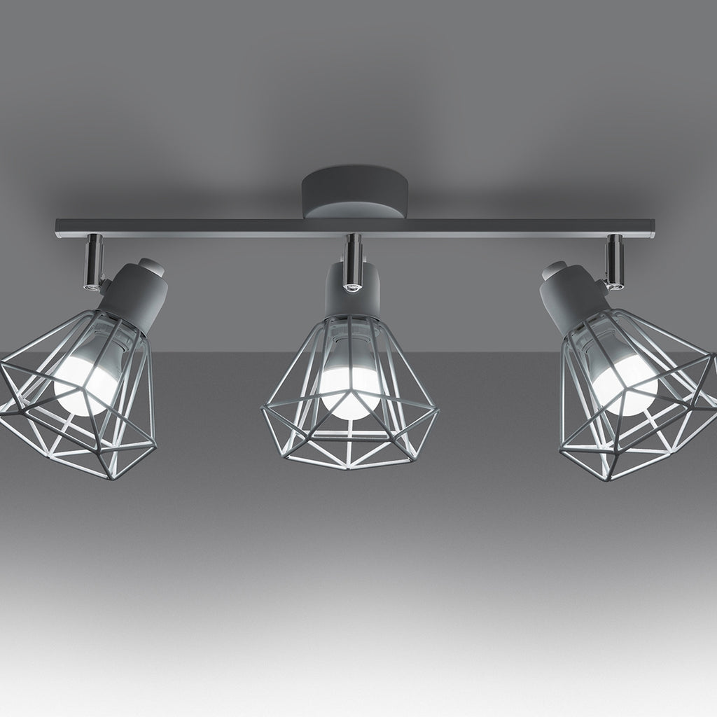 Plafonnier Artemis 3 blanc allumé, ombres géométriques des cages