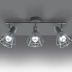 Plafonnier Artemis 3 blanc allumé, ombres géométriques des cages