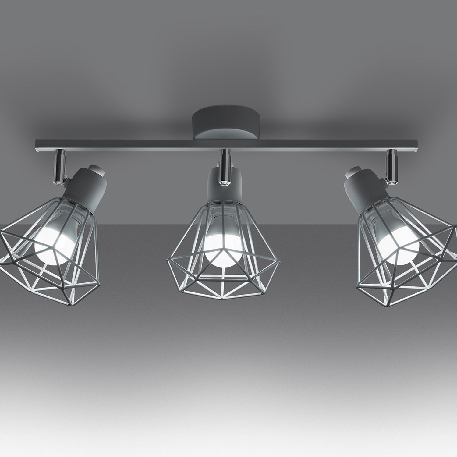 Plafonnier Artemis 3 blanc allumé, ombres géométriques des cages