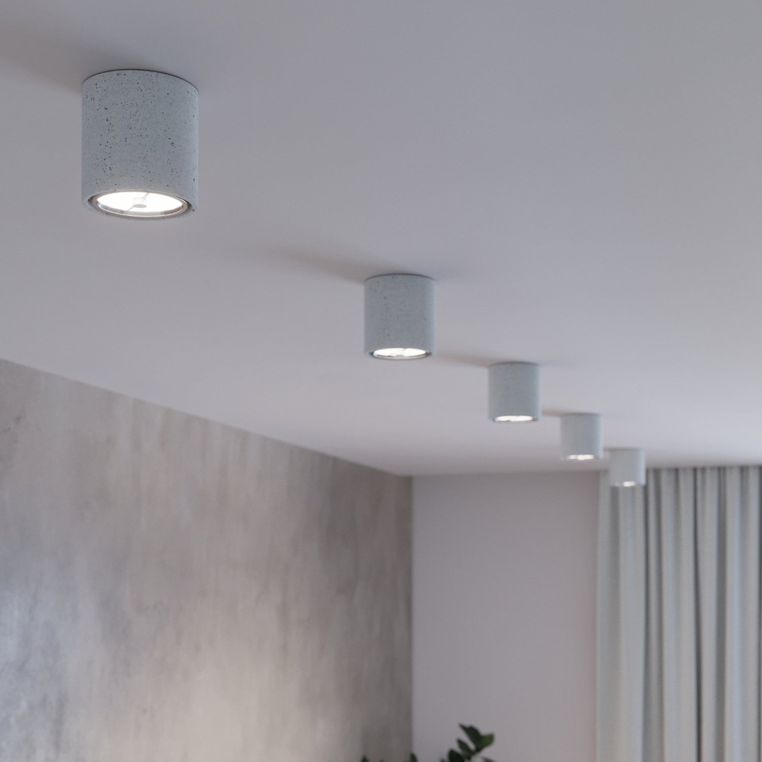 Plafonnier Cullo en béton dans un intérieur industriel