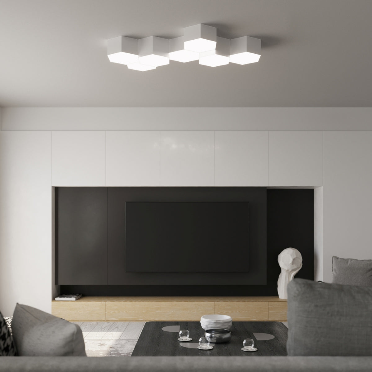 Plafonniers Sunde PVC blanc allumés en nid d'abeille au plafond d'un salon au-dessus d'un meuble télé